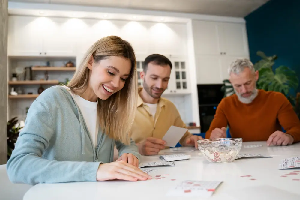 Three generations sitting around the table reviewing financial plans together, symbolizing family wealth planning.